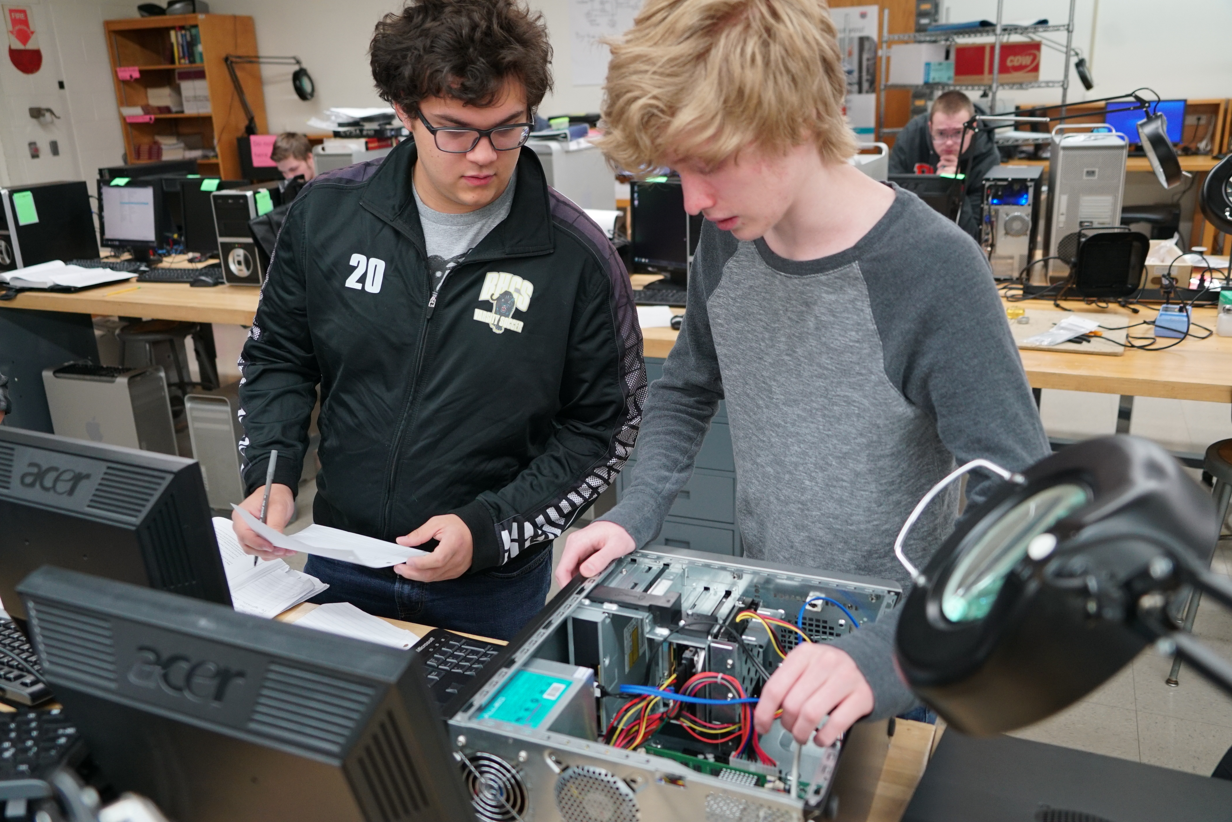 students work together on computer